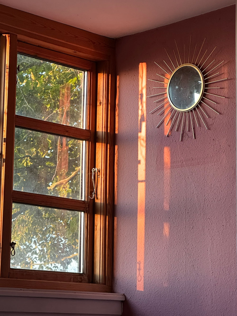 Casa Creativiva — warm light through an old window at golden hour